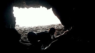 Couple recorded at the beach, inside the cave