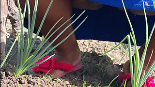 Hot stepmom went to the garden in a dress without panties and neighbor filmed